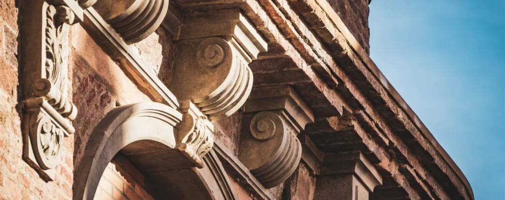 Carved stone cornice and modillions on a historic facade